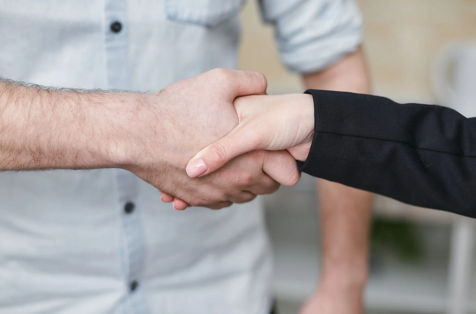 cleveland plumbing company team shaking hands with a customer after a completed repair