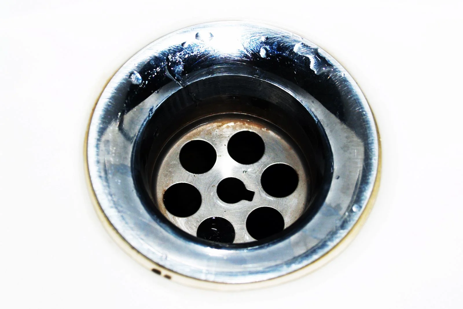 close view of a chrome sink strainer before a clogged drain service cleveland tn visit
