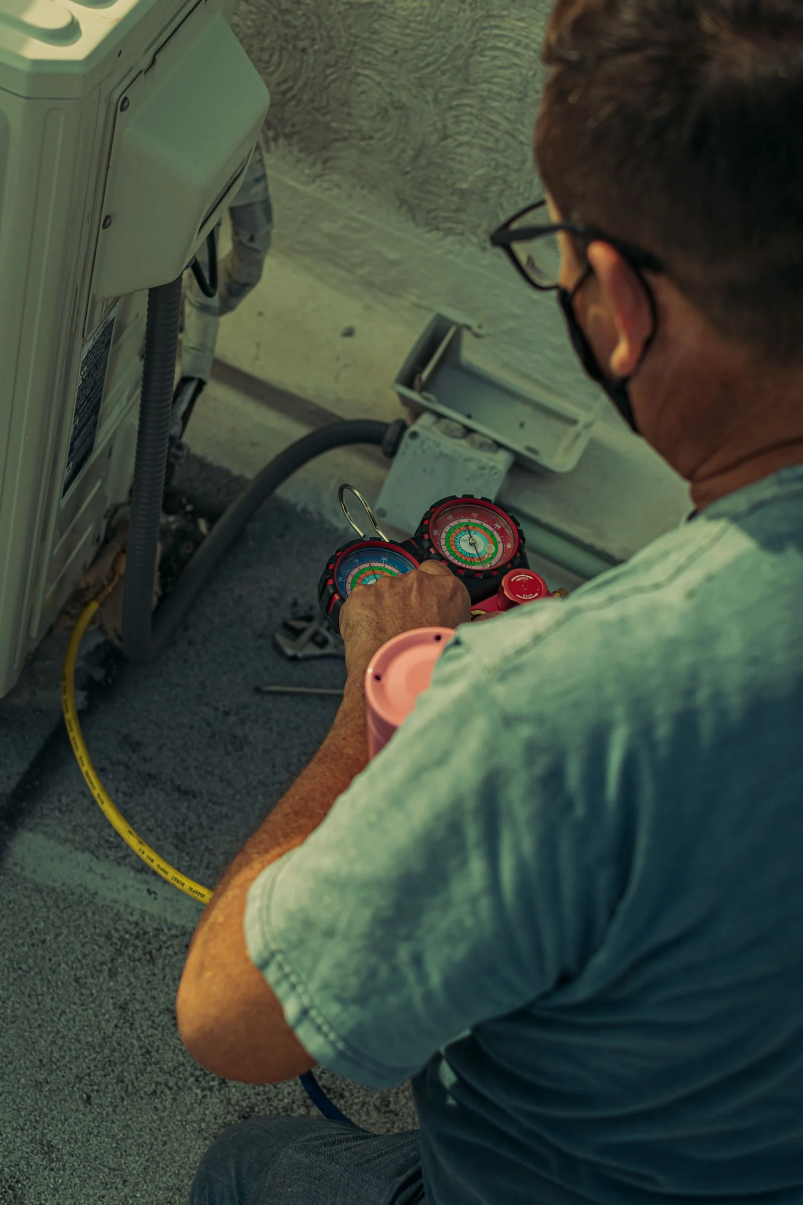 plumbing contractors cleveland tn at work repairing a pipe connection on site