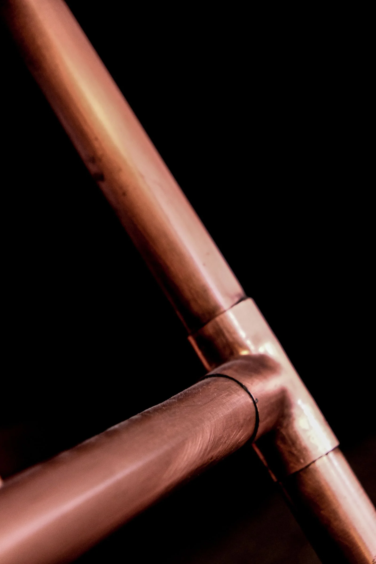 a soldered copper tee joint on new water supply pipe, one of the two materials a whole house repiping in Cleveland TN goes back in as